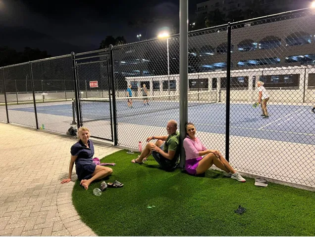 Pickle ball players resting