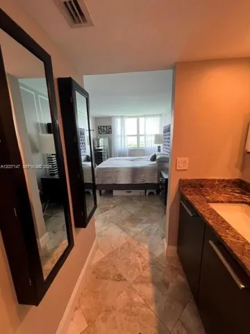 View from powder sink into master bedroom