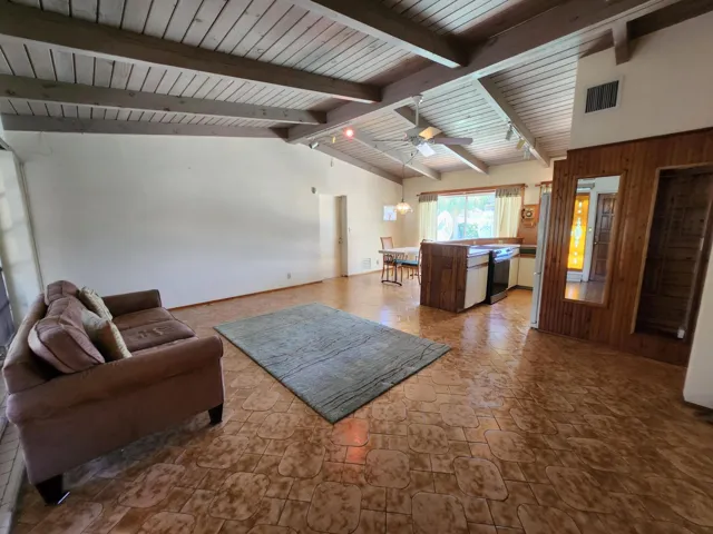 With raised, beamed ceiling!
