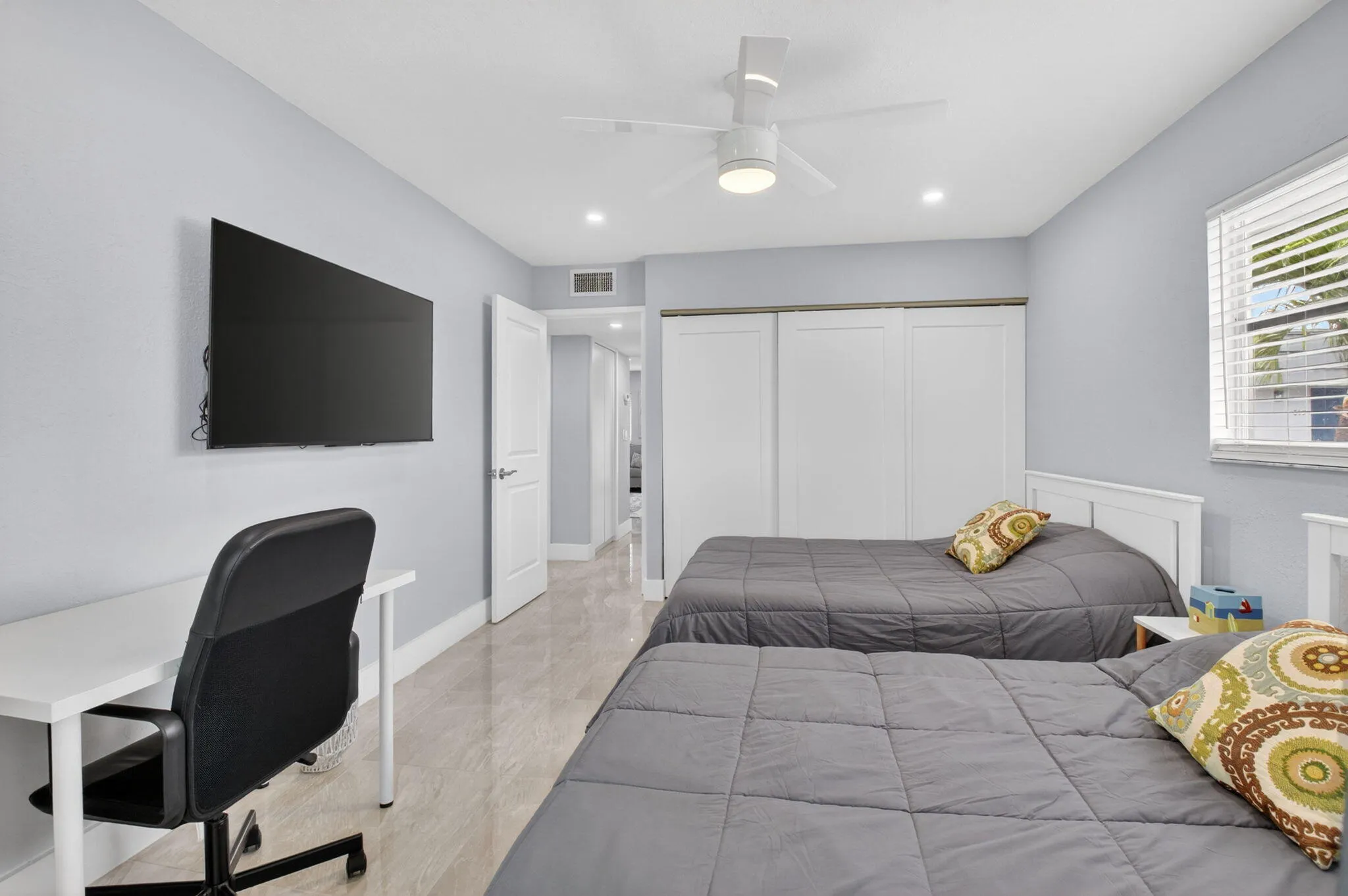 Second bedroom features full wall closet & desk for your work needs!