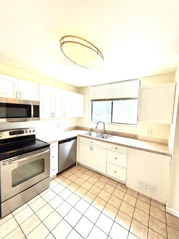 kitchen facing hallway and entrance