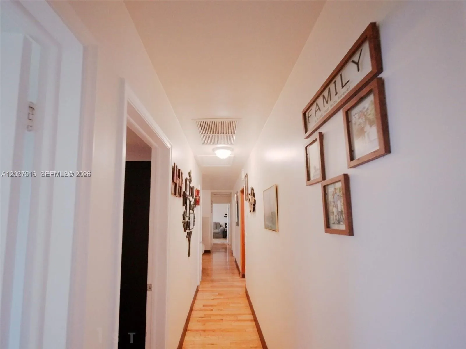 Hallway, flanked by the two Primary Suites