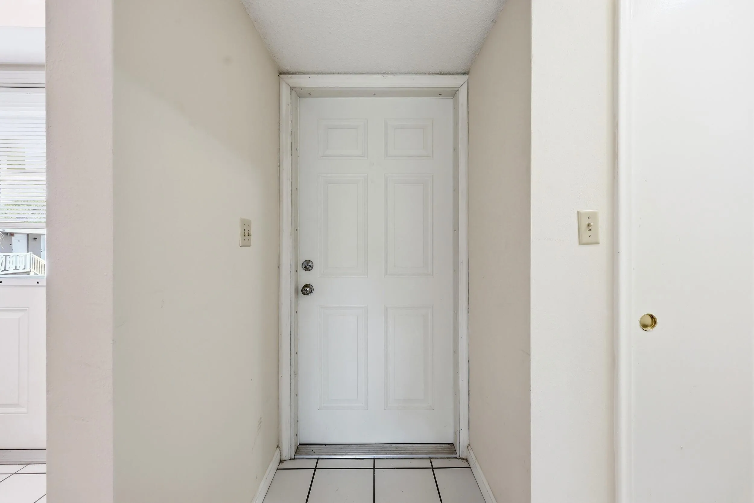 A covered front entry welcomes you home and provides a private entrance to this second-floor residence. The bright interior foyer creates a smooth transition into the main living areas while offering a convenient space for greeting guests and everyday arrivals.