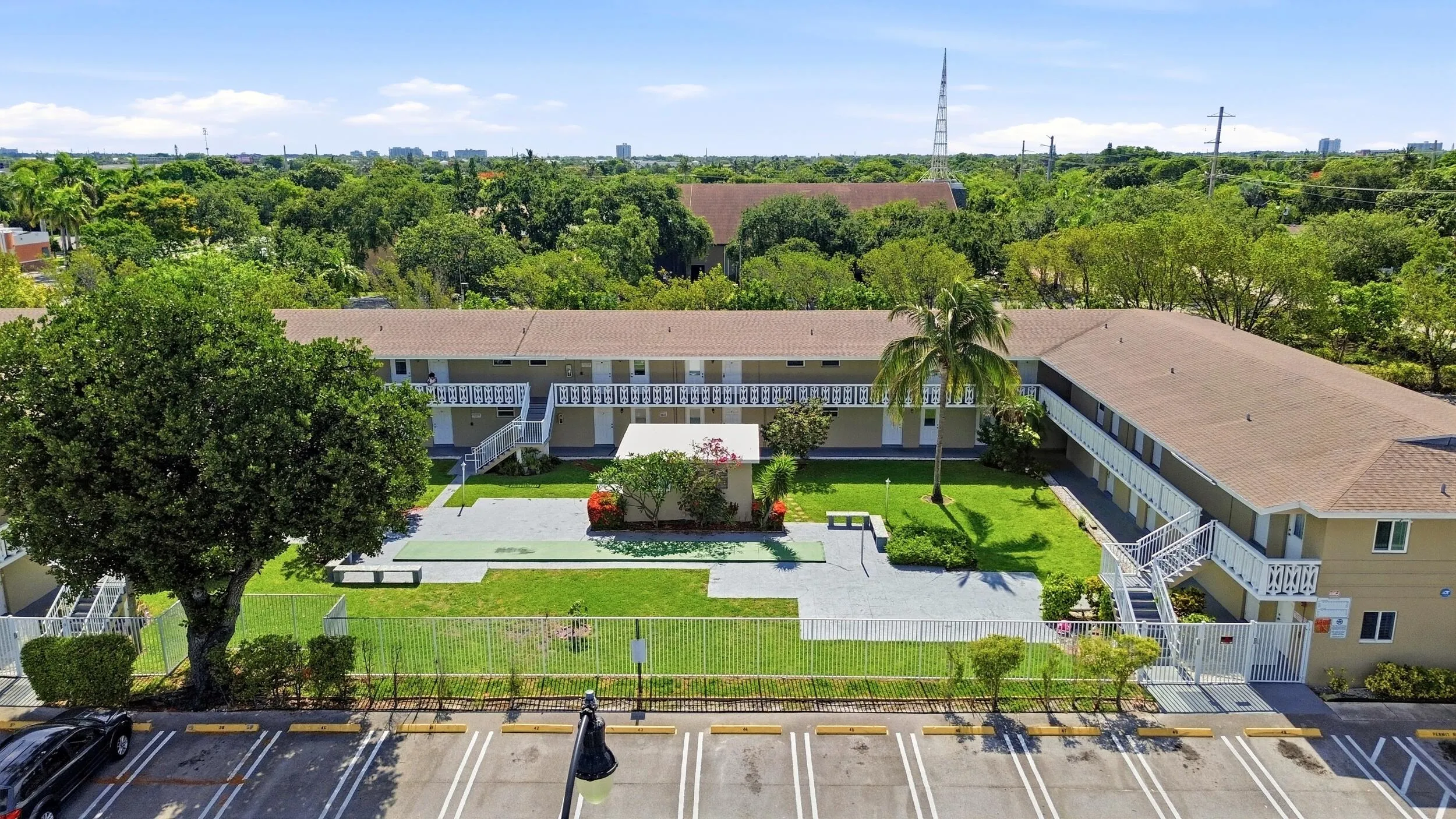 Experience the charm of this beautifully maintained Delray Beach community featuring lush tropical landscaping, abundant parking, expansive green spaces, and a recently renovated resort-style pool with an oversized sundeck. Designed around a welcoming courtyard setting, the community offers residents a peaceful atmosphere while remaining just minutes from the beach, Atlantic Avenue, shopping, dining, golf, and everyday conveniences. The attractive layout, manicured grounds, and inviting outdoor amenities create the perfect blend of comfort, convenience, and relaxed South Florida living.