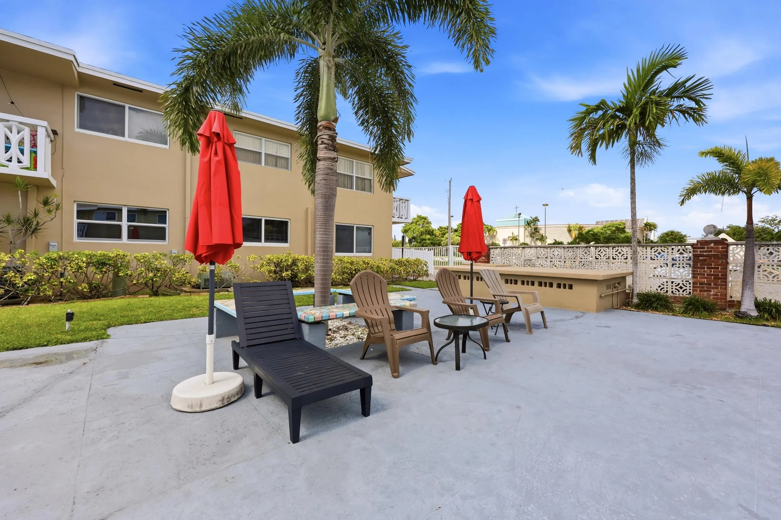 The resort-style community pool and sundeck provide the perfect setting to relax and enjoy South Florida's year-round sunshine. Recently renovated in 2025, the pool area features expansive deck space, tropical landscaping, lounge seating, and shaded gathering areas ideal for socializing with neighbors or unwinding after a day at the beach. Surrounded by swaying palm trees and well-maintained grounds, this inviting outdoor amenity creates a peaceful retreat just steps from home. The building was freshly painted in 2024, further enhancing the pride of ownership throughout the community.