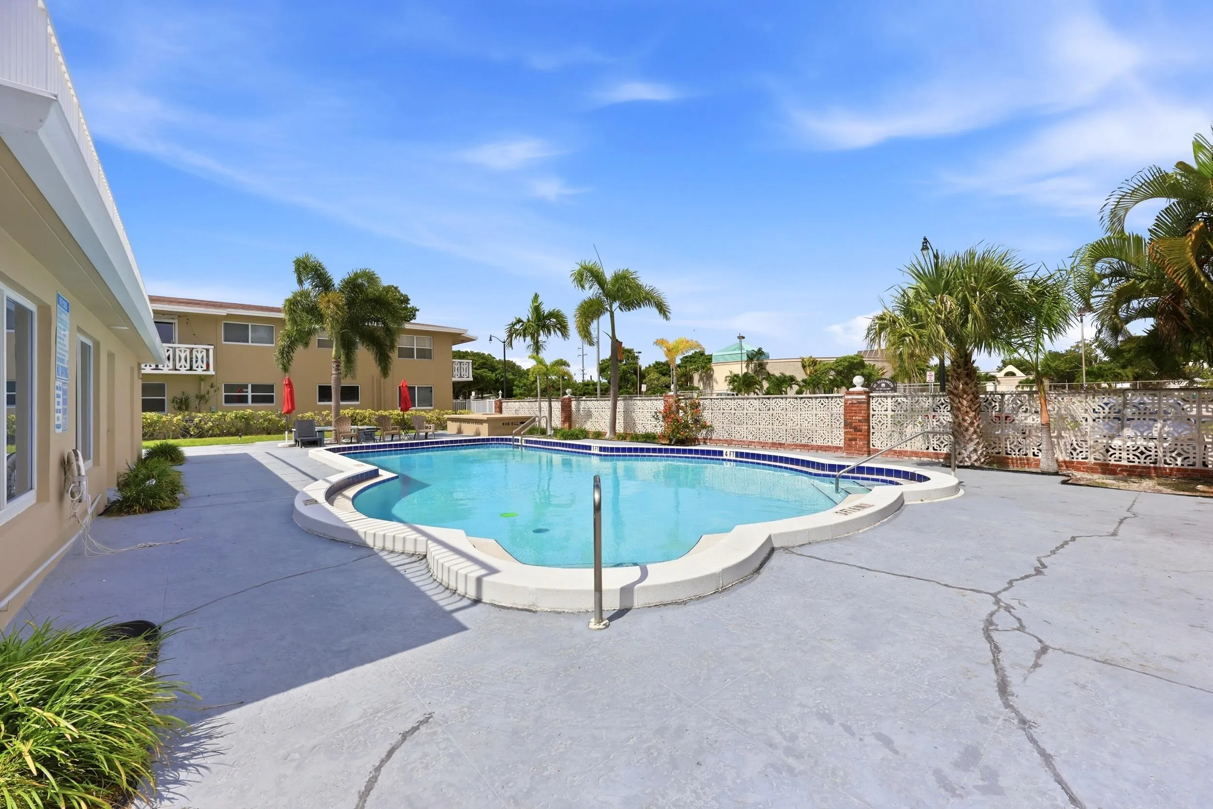 The resort-style community pool and sundeck provide the perfect setting to relax and enjoy South Florida's year-round sunshine. Recently renovated in 2025, the pool area features expansive deck space, tropical landscaping, lounge seating, and shaded gathering areas ideal for socializing with neighbors or unwinding after a day at the beach. Surrounded by swaying palm trees and well-maintained grounds, this inviting outdoor amenity creates a peaceful retreat just steps from home. The building was freshly painted in 2024, further enhancing the pride of ownership throughout the community.