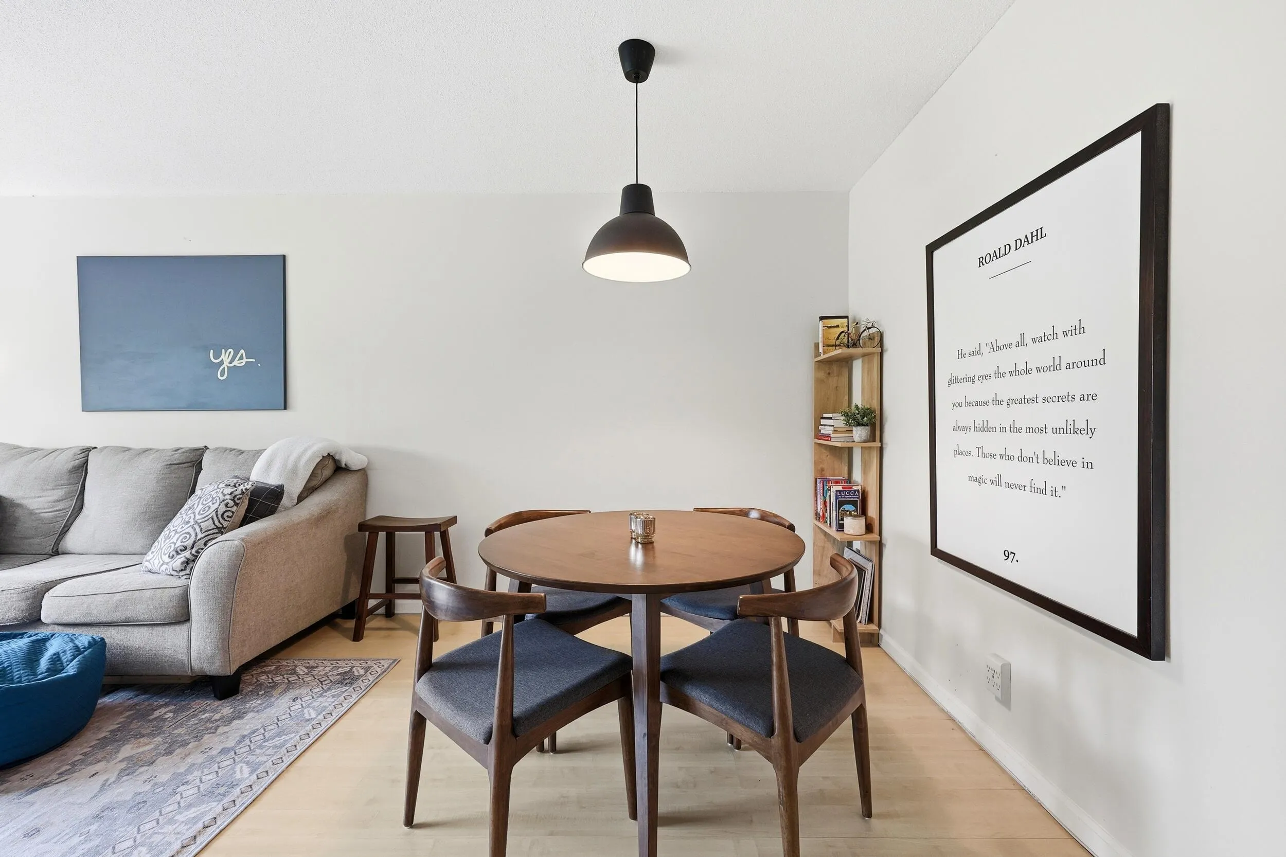 The dining area is seamlessly integrated into the main living space, creating an open and inviting environment for everyday meals and entertaining. Generous proportions easily accommodate a full dining set, while the central location between the living room and kitchen enhances both functionality and flow. The modern pendant lighting adds warmth and character, and the open-concept design allows the space to feel bright, connected, and welcoming for gatherings of any size.