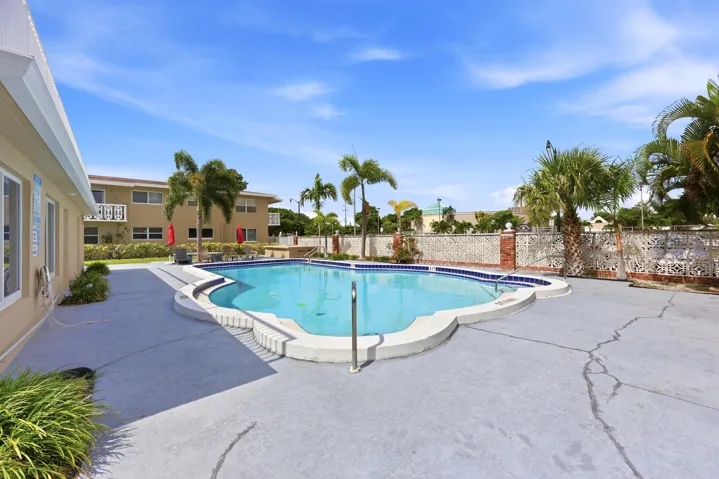 The resort-style community pool and sundeck provide the perfect setting to relax and enjoy South Florida's year-round sunshine. Recently renovated in 2025, the pool area features expansive deck space, tropical landscaping, lounge seating, and shaded gathering areas ideal for socializing with neighbors or unwinding after a day at the beach. Surrounded by swaying palm trees and well-maintained grounds, this inviting outdoor amenity creates a peaceful retreat just steps from home. The building was freshly painted in 2024, further enhancing the pride of ownership throughout the community.