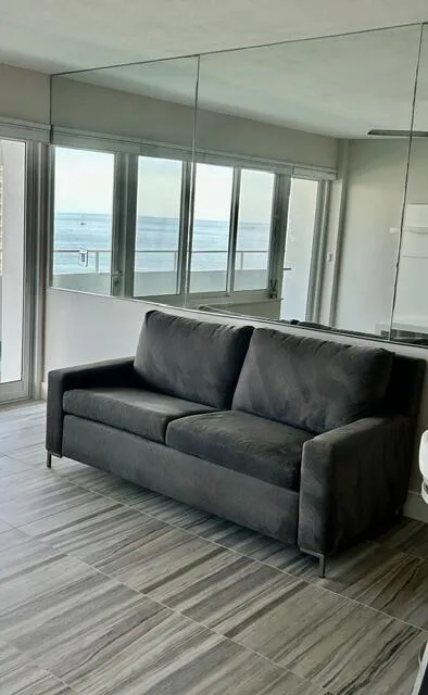 MIRROR ON WEST WALL REFLECTS THE OCEAN