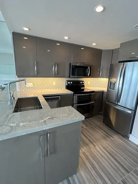 TOP OF THE LINE CABINETS , COUNTER TOPS, AND BACKSPLASH TILES