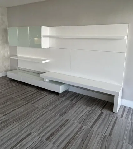 CUSTOM WALL UNIT ACCOMODATES LARGE TV WITH LOTS OF EXTRA STORAGE