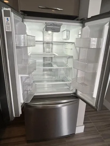 WHIRLPOOL REFRIGERATOR IS ONE YR OLD