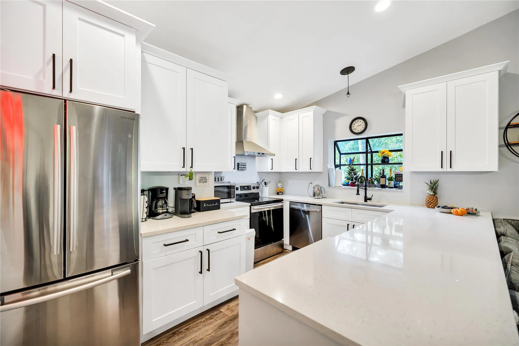 Stainless Steel Appliances: French door Refridgerator w freezer drawer below, Electric Range, SS Hood, and Dishwasher. Plenty of storage, and recessed lighting.