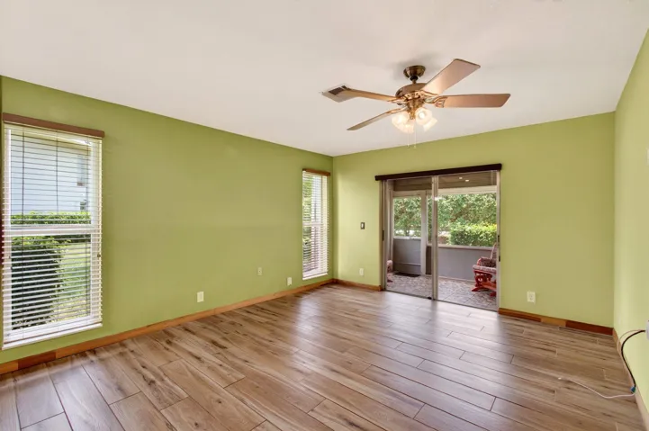 Primary bedroom with screened patio access