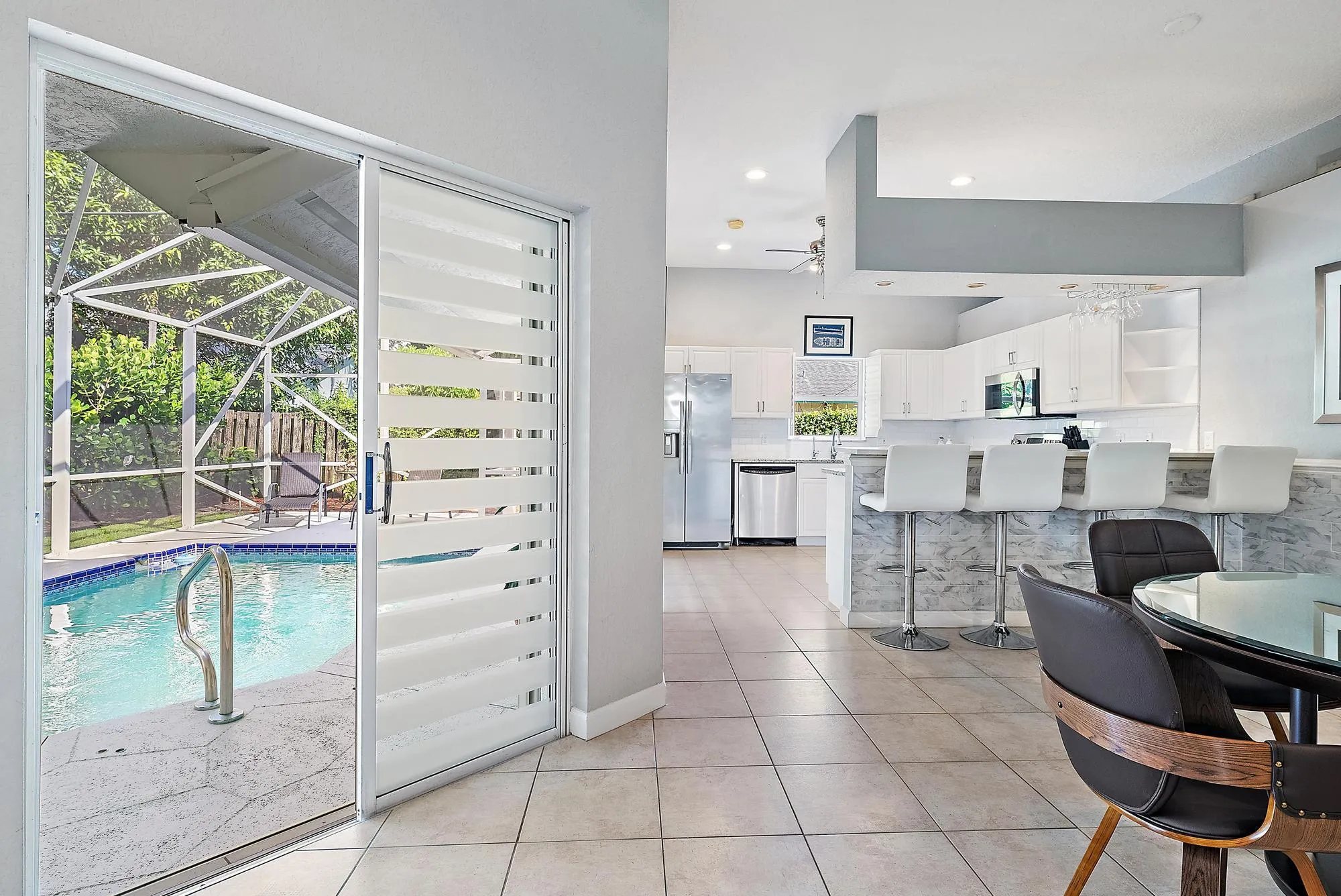 Dining room opens to pool