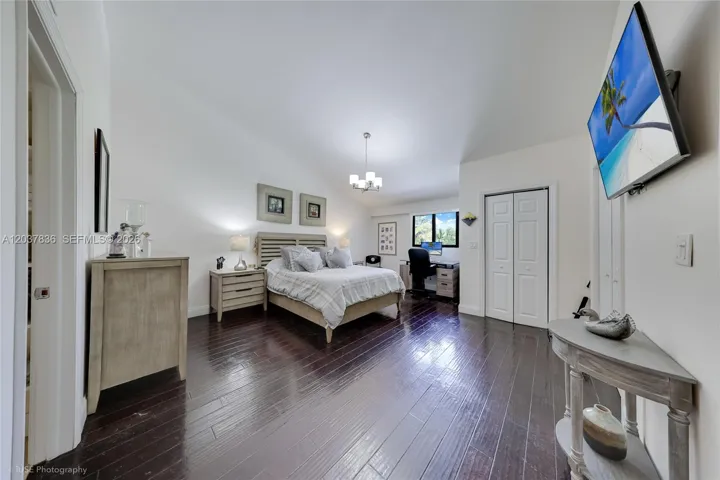 Large Master Bedroom with 2 walking closets and sppace for a desk looking the Golf court