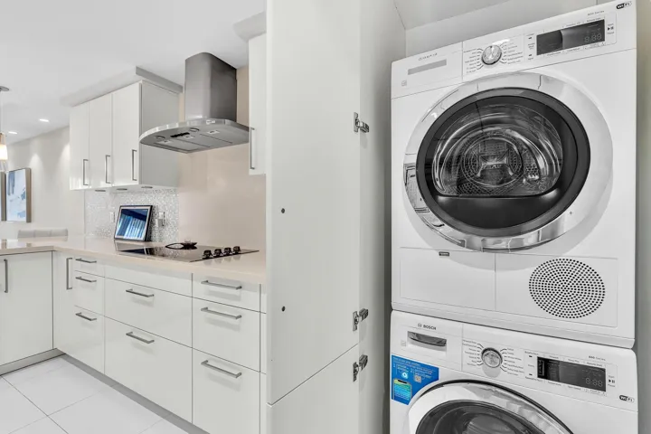 Bosch Washer/Dry in Kitchen Behing Custom Cabinetry