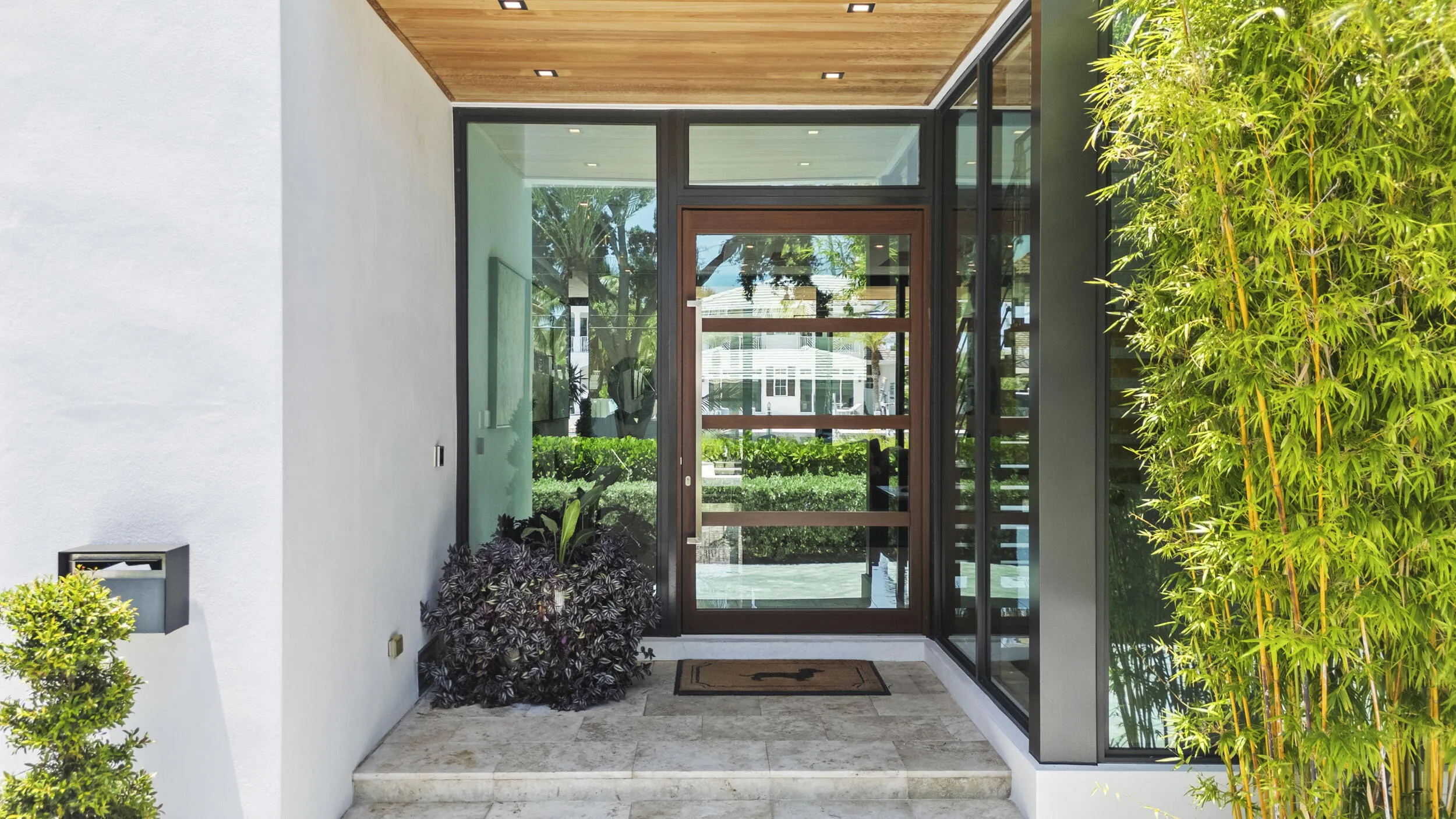 Oversized Pivot Entry Door.