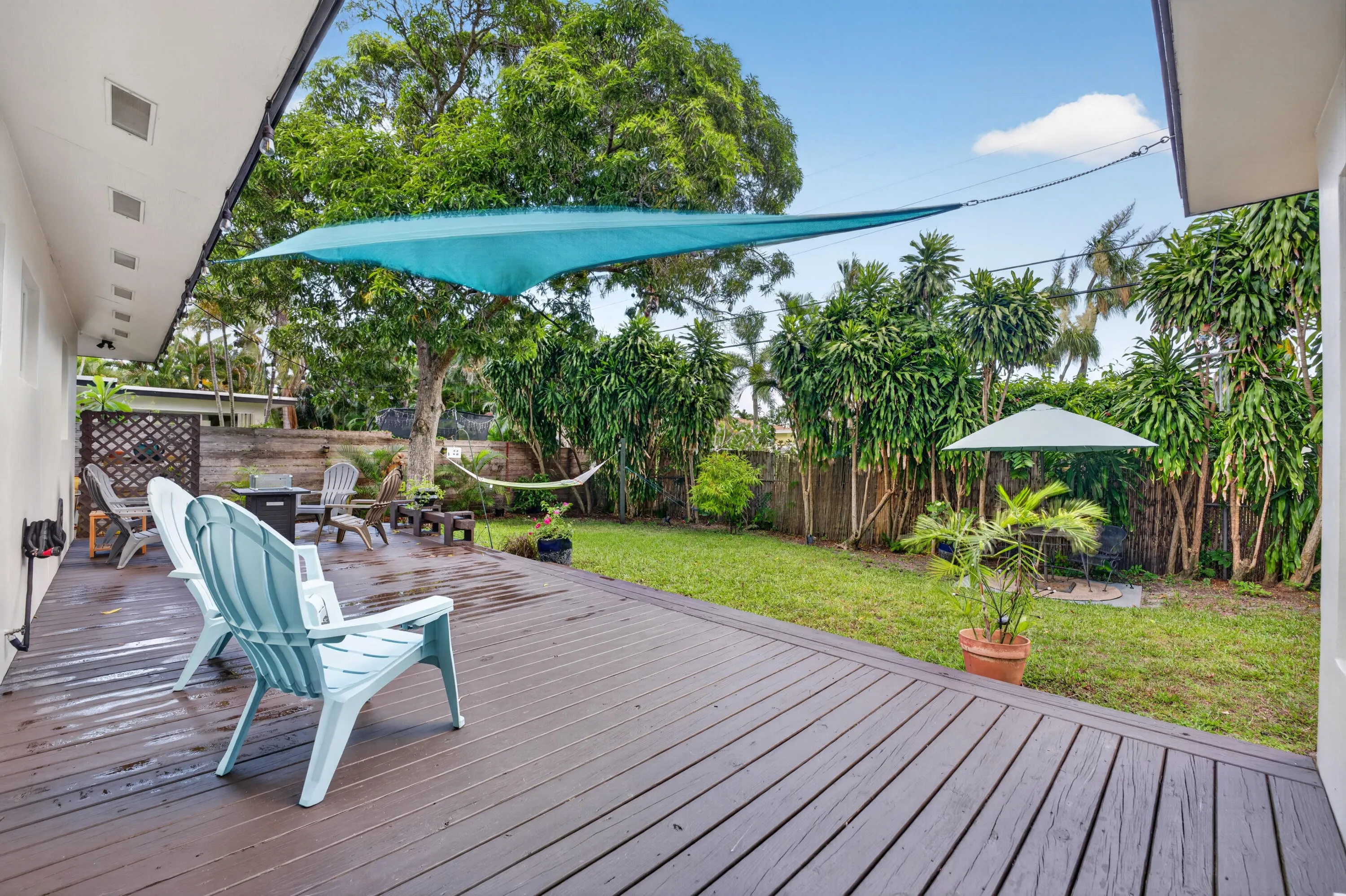 Beautiful wooden deck highlights the back oasis.