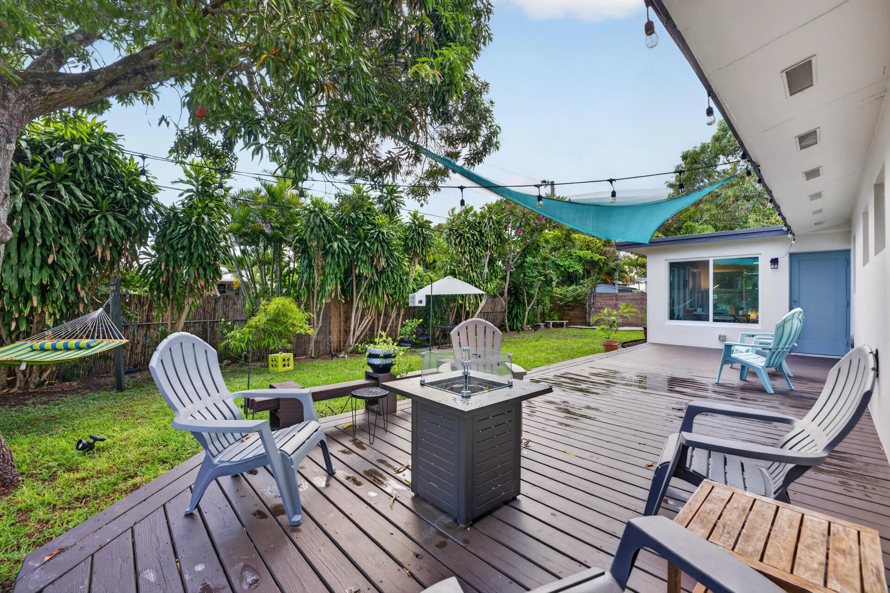 Beautiful wooden deck highlights the back oasis.