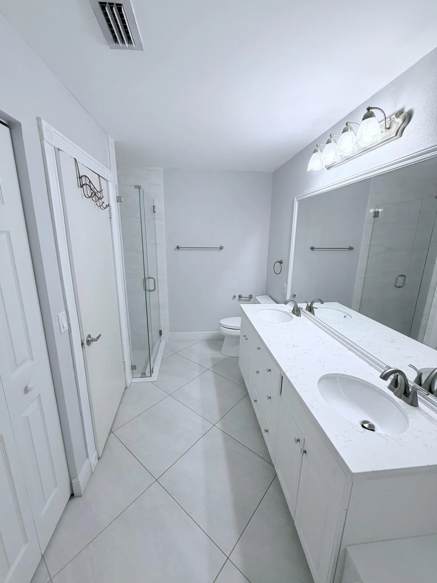 Double sinks with separate shower and tub