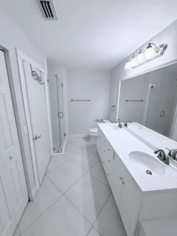 Double sinks with separate shower and tub