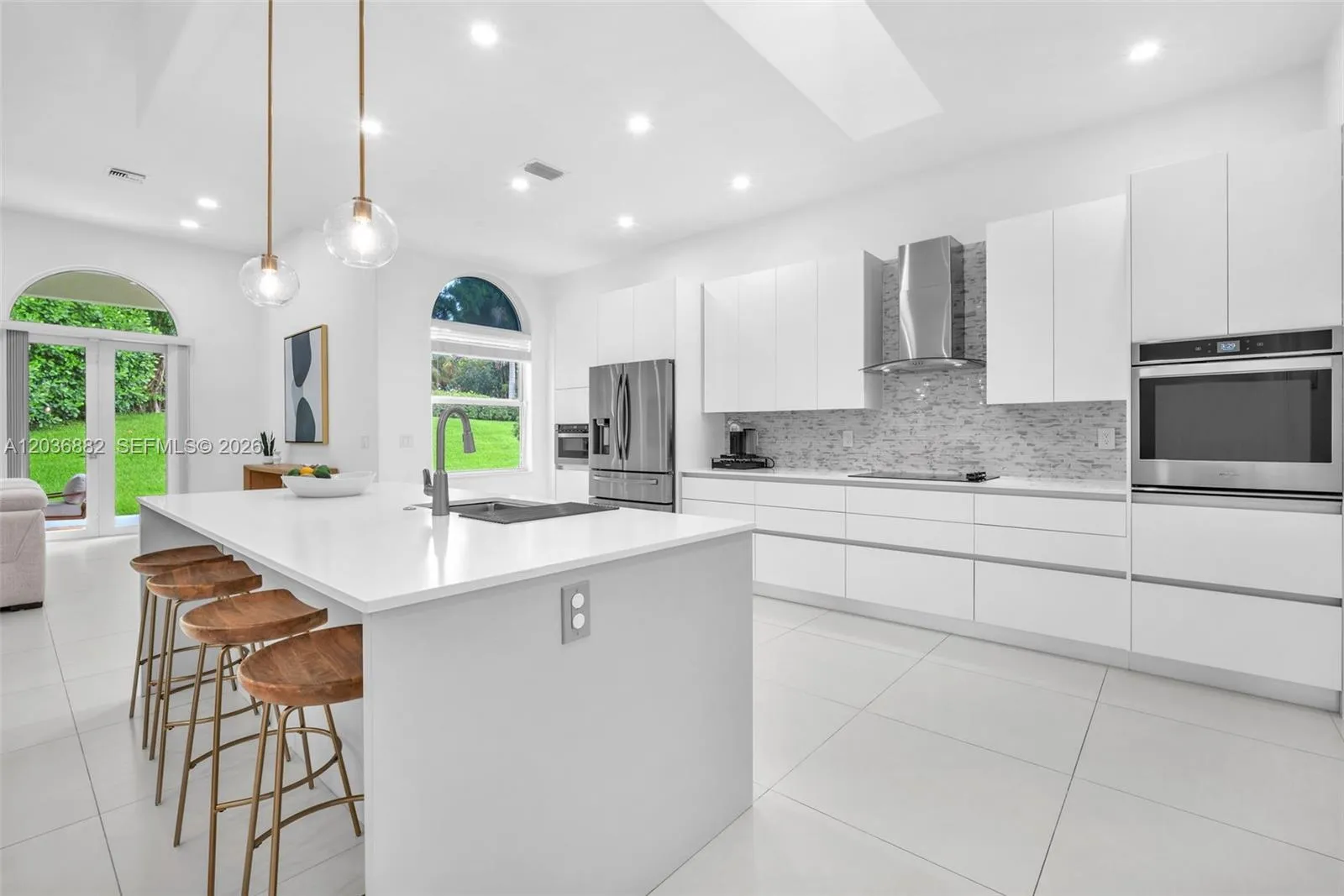 Remodeled kitchen with island and dine in bar stool station