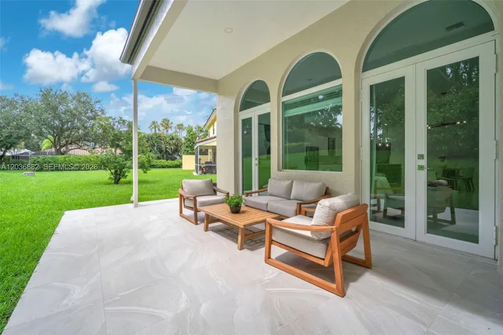 Large covered patio with plenty space to lounge or entertain