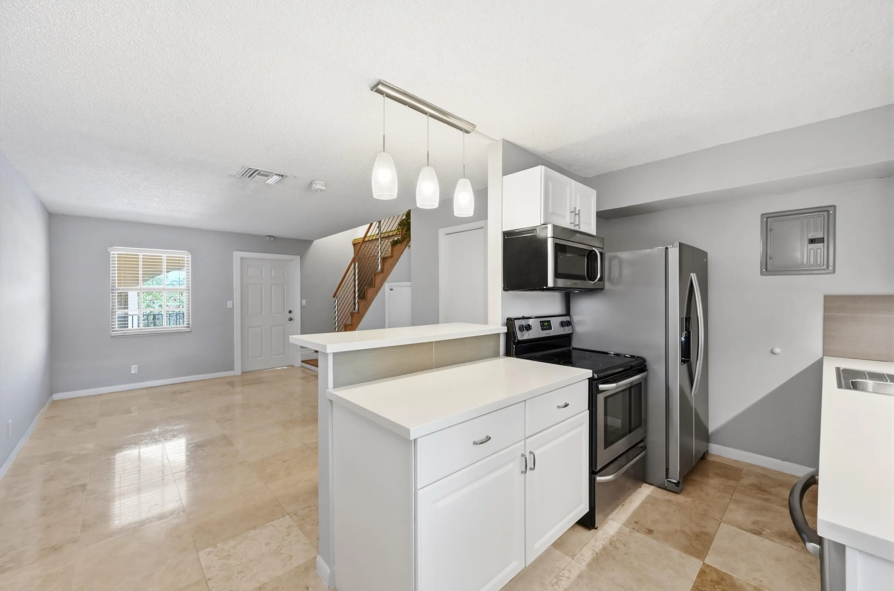 Updated kitchen with stainless steel appliances and abundant cabinetry.
