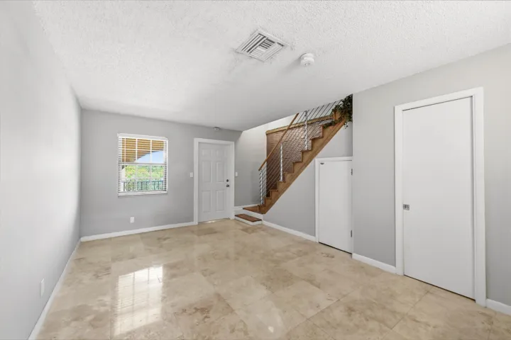 Spacious living room featuring beautiful flooring and an open, inviting atmosphere.