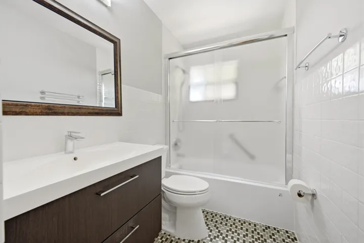 Beautifully remodeled upstairs bathroom featuring a tub and shower combination.