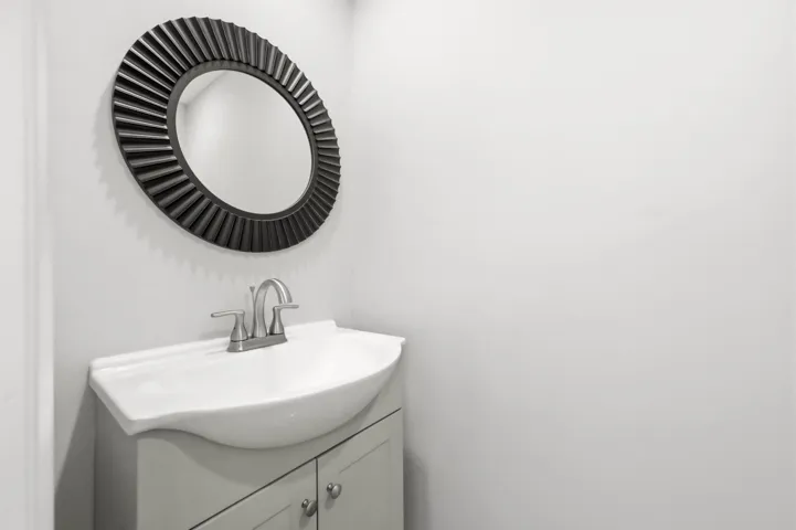 Additional view of the half bathroom serving the main living area.