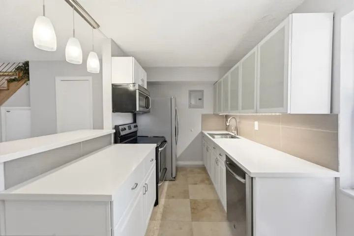 Well appointed kitchen showcasing stainless steel appliances and beautiful cabinetry.