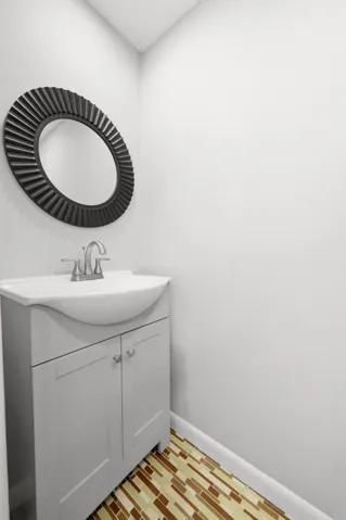 Convenient half bathroom located off the main living area.