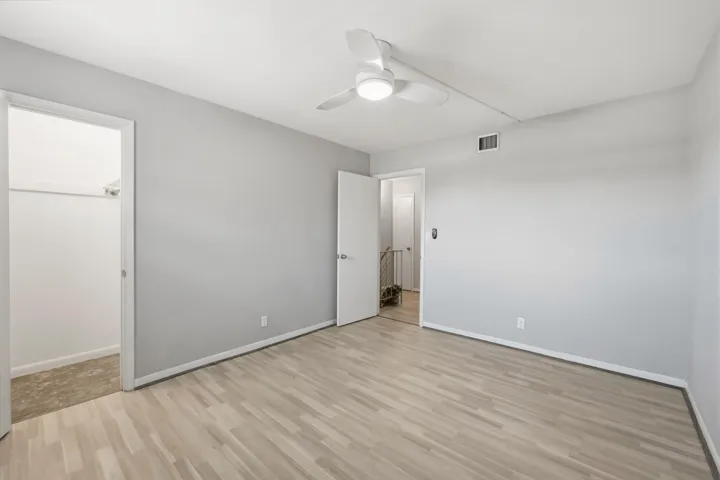 Spacious bedroom featuring a functional layout.