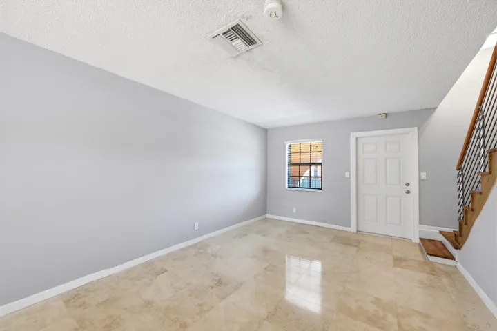 Living room featuring beautiful flooring and an inviting open layout.