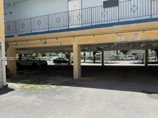 Covered parking area located on West 44th Street side of the building.