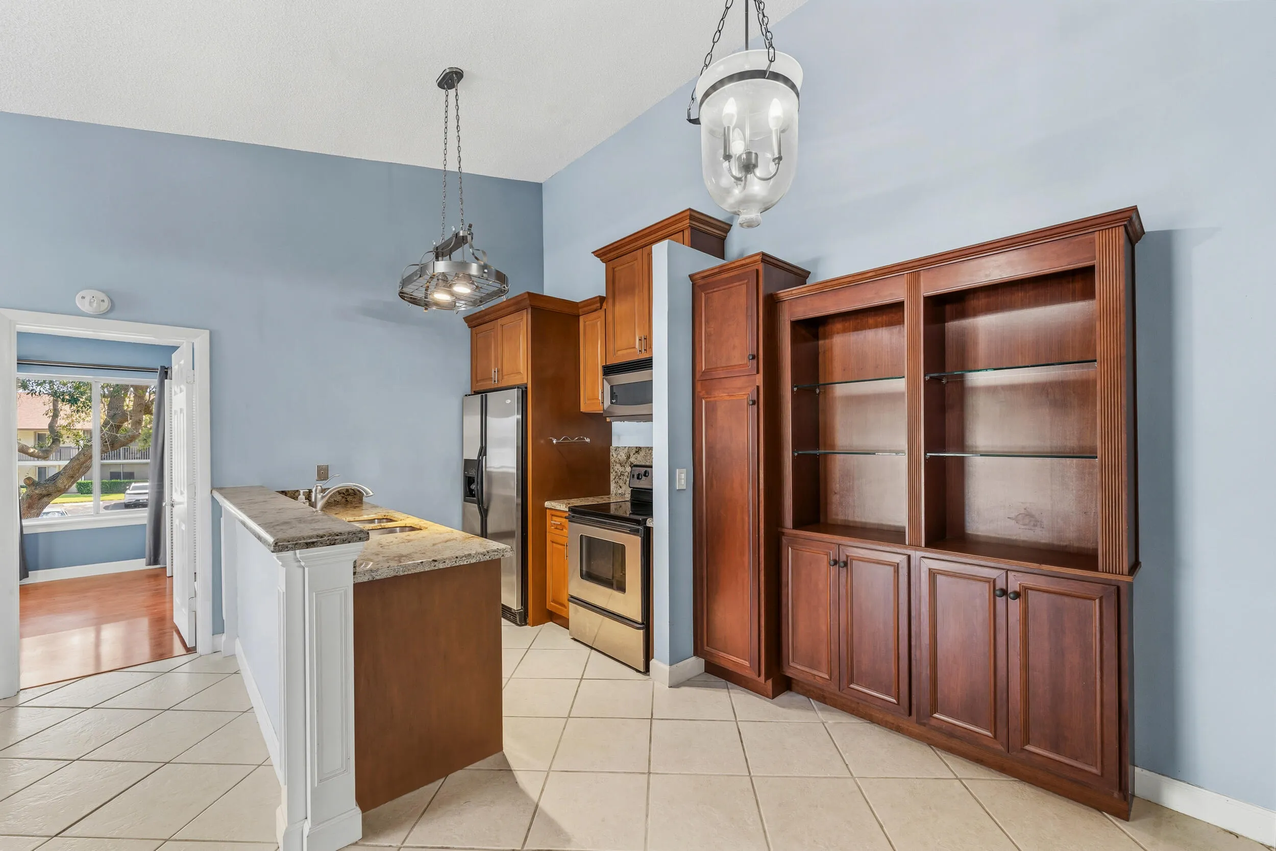 Updated kitchen with granite counertops and built ins in the dining area.