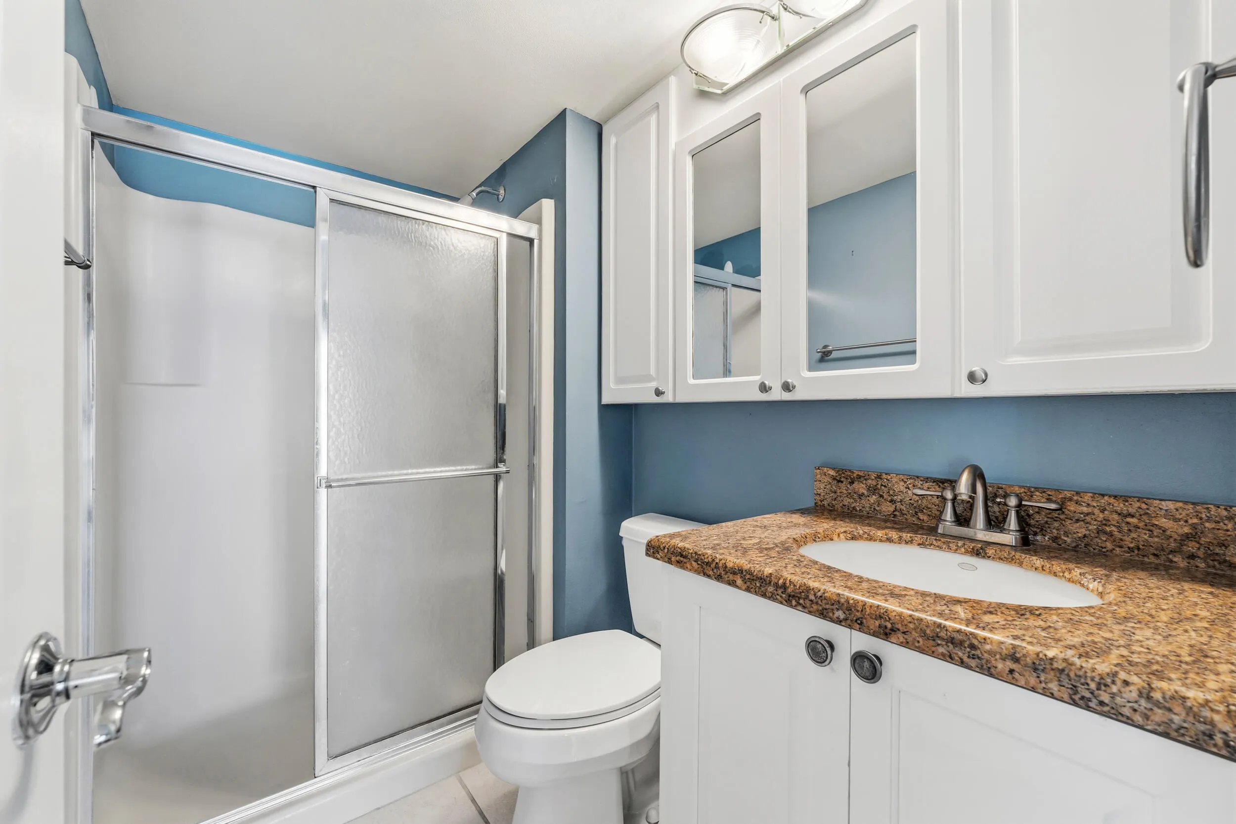 Primary bathroom with comfort height toilet and vanity