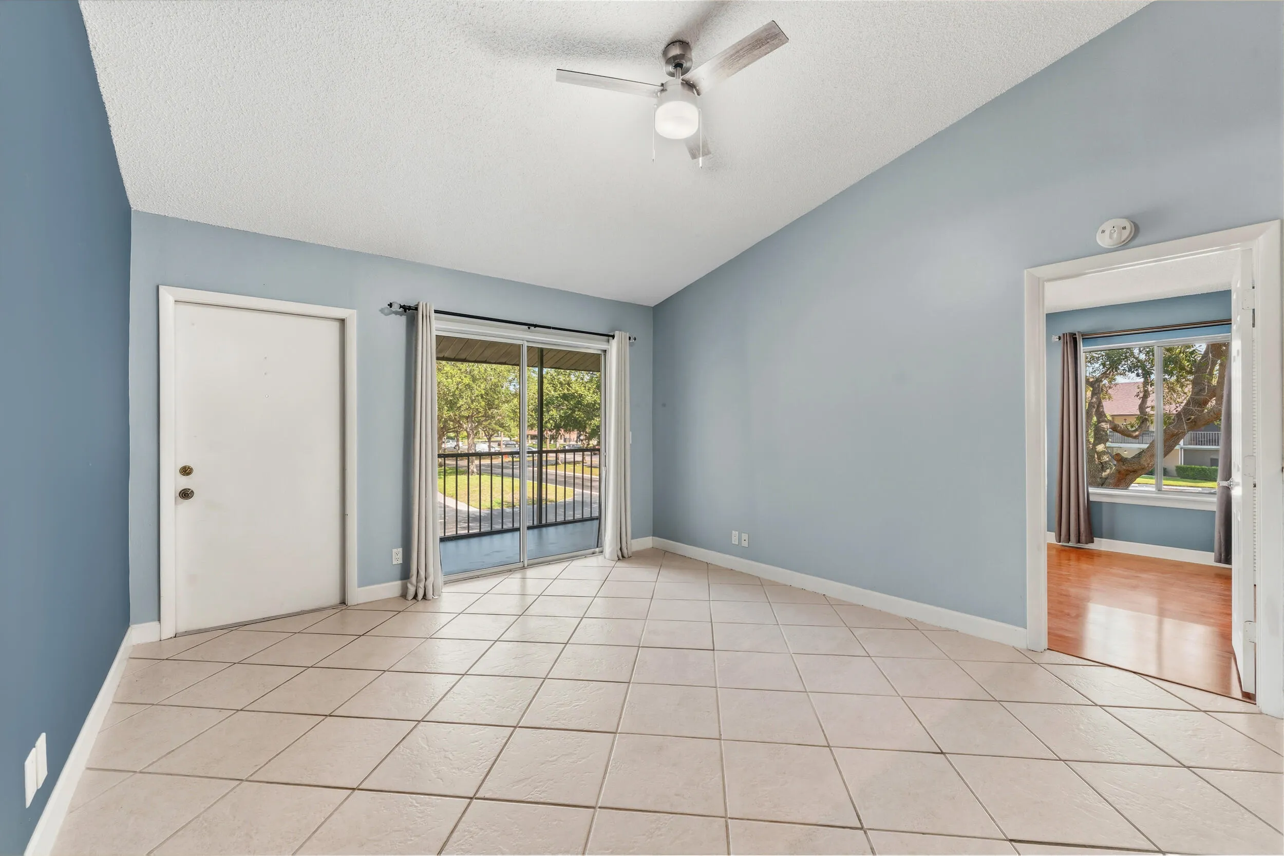 Living area with a slider out to the screen balcony