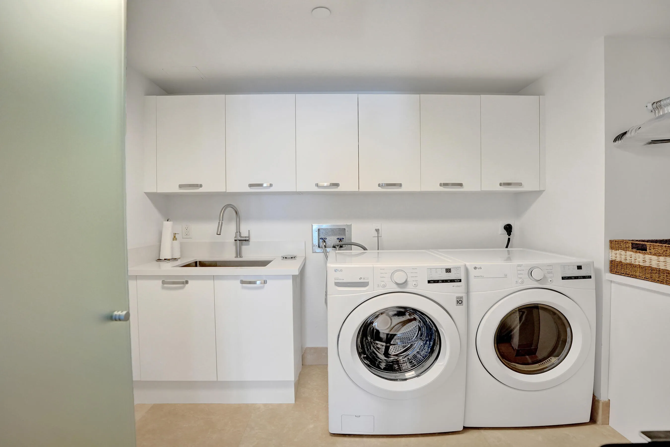 Laundry and Utility Room with Sink, full-sized machines and plentiful storage