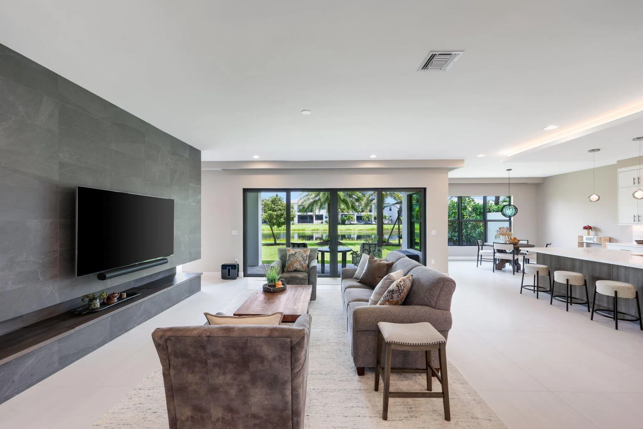 Living room w extended feature wall, tiled on both sides.