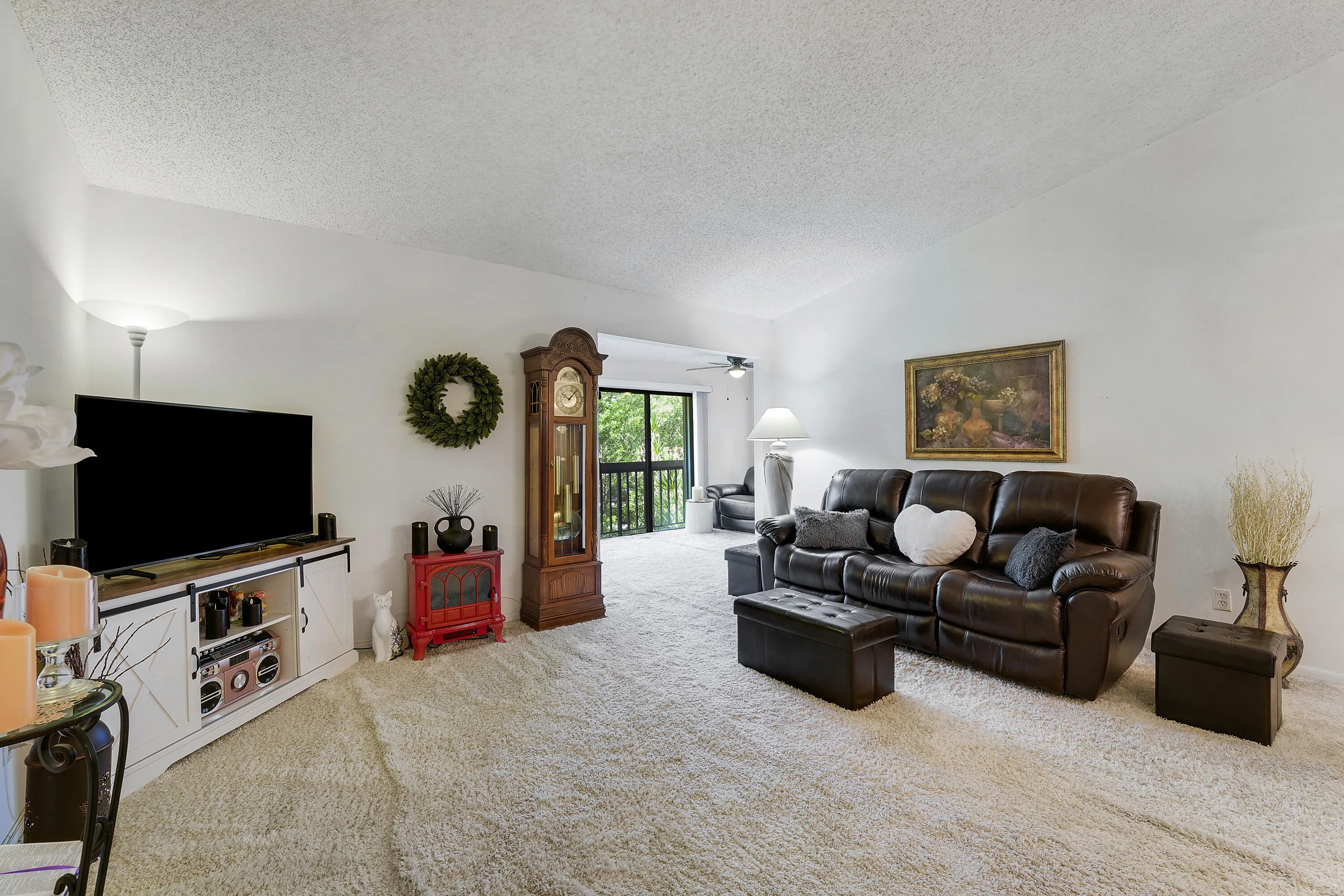 Living room area with high ceilings