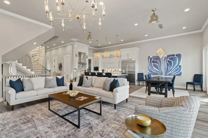 Striking designer finishes, dramatic lighting, and expansive open living spaces create an atmosphere that feels both luxurious and instantly welcoming — a home made for unforgettable moments with family and friends.