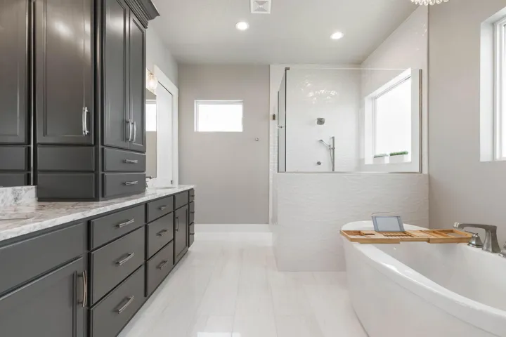 Indulge in spa-inspired luxury with a soaking tub, oversized walk-in shower, and designer finishes that make every day feel like a five-star retreat.