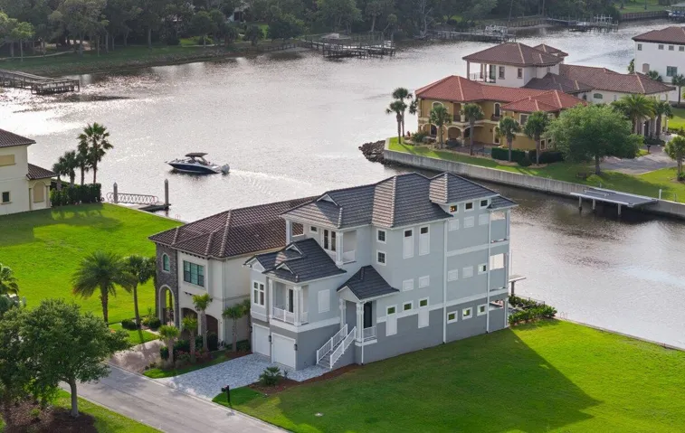 Welcome to 18 Spinaker Circle, where waterfront living and the relaxed elegance of Yacht Harbor Village create an unforgettable coastal lifestyle.