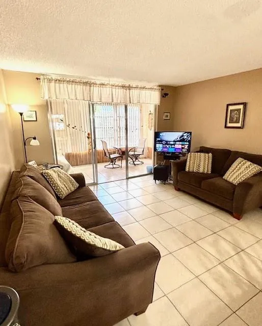 Living room toward patio. Furniture included.