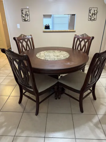 Dining area to kitchen pass-thru opening. Furniture included.