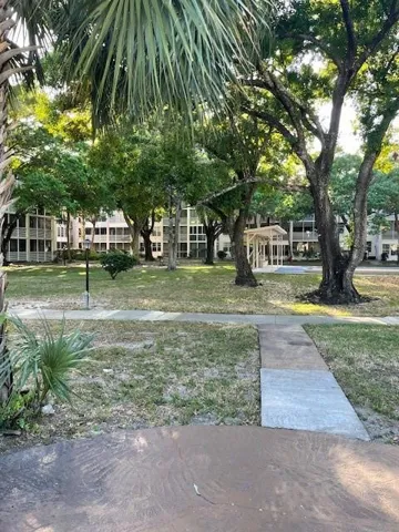 Courtyard with picnic area and grill.