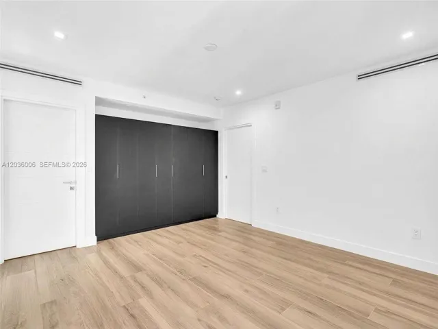 Bedroom with Wall unit closets